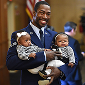 Veteran father holding twin babies