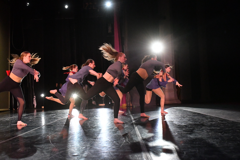 SLCC Dance Company members perform on stage