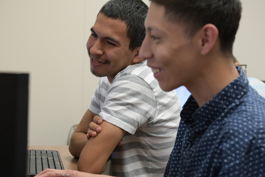 Two TRIO students at a computer.