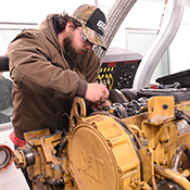 Mechanic working on diesel engine