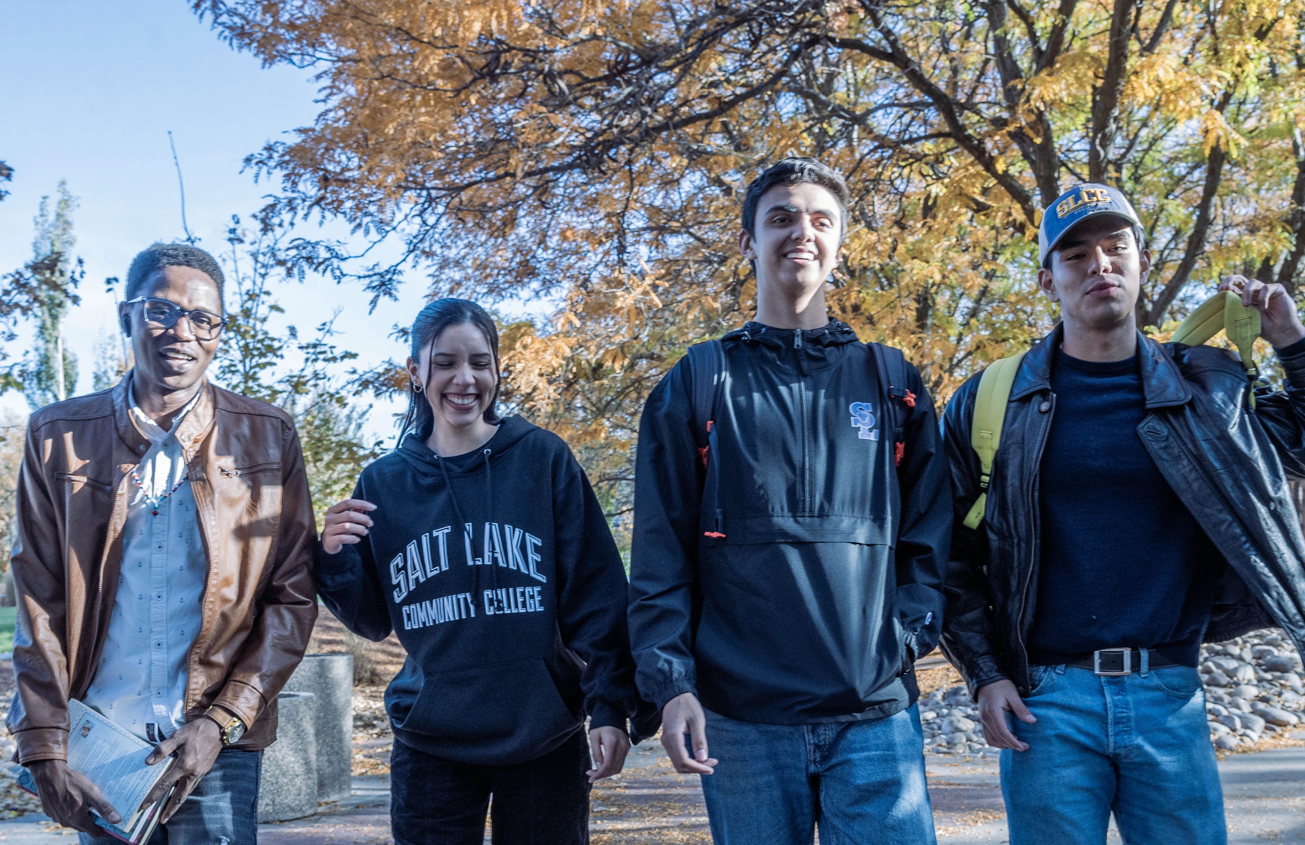 Four students walking on campus