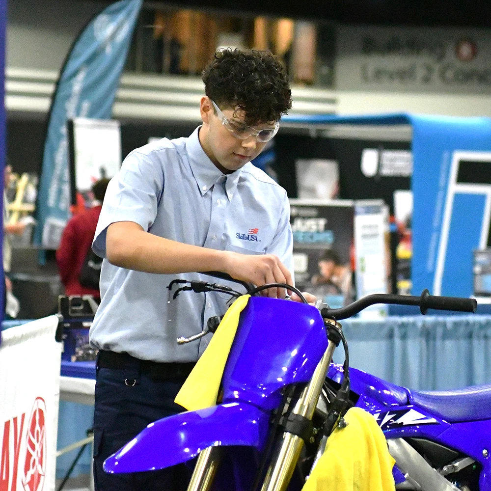 Man works on motorcycle
