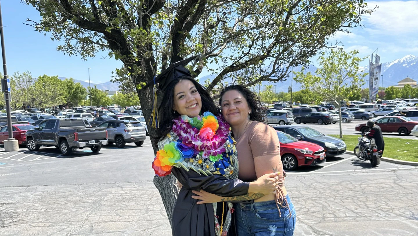 Angelique (center) with her mother, Rose (right), after the graduation ceremony.