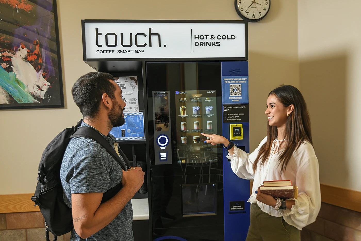 Student(s) purchase a drink from Touch Coffee vending machine. 