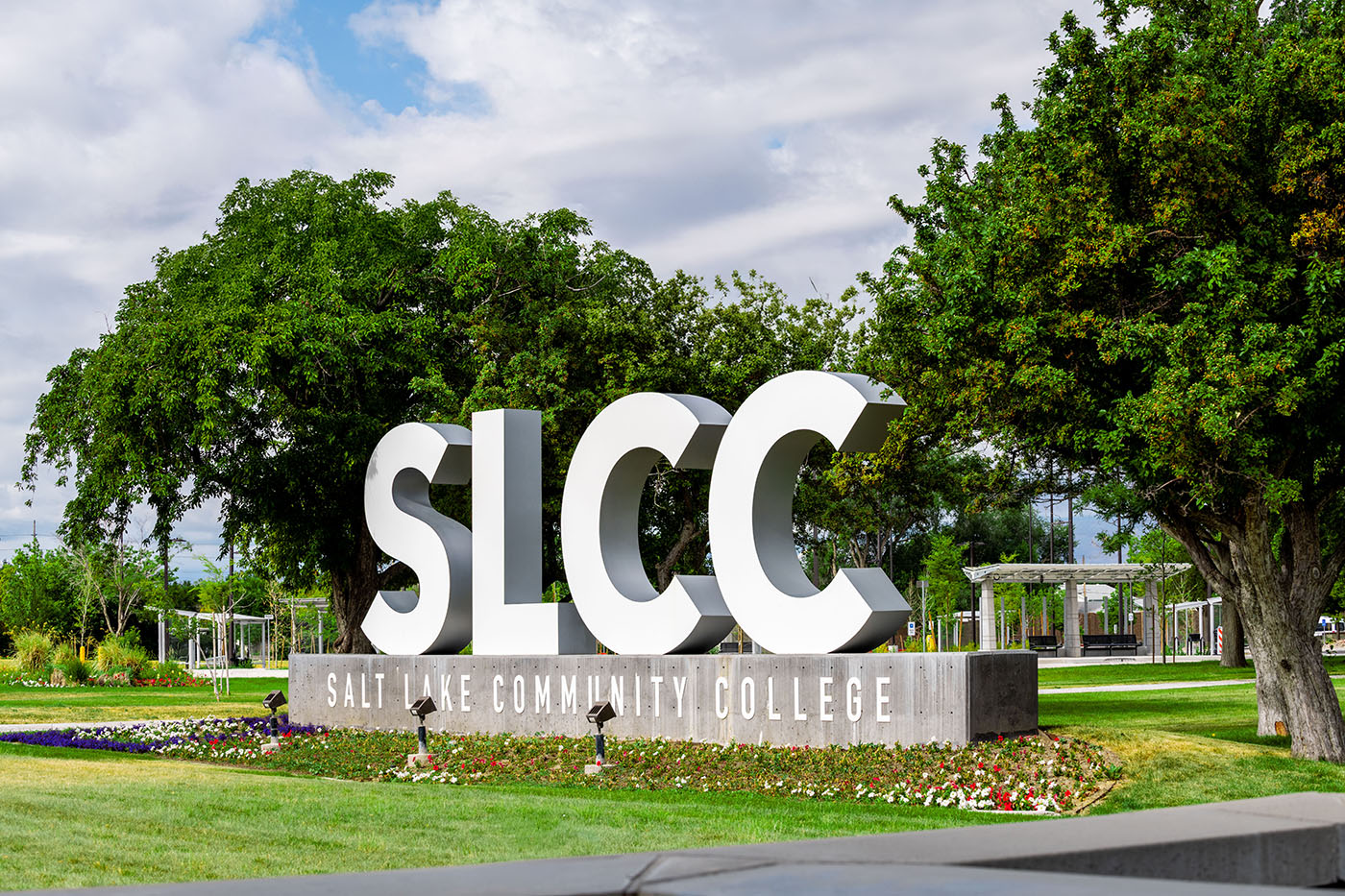 SLCC letter signs with trees on the background