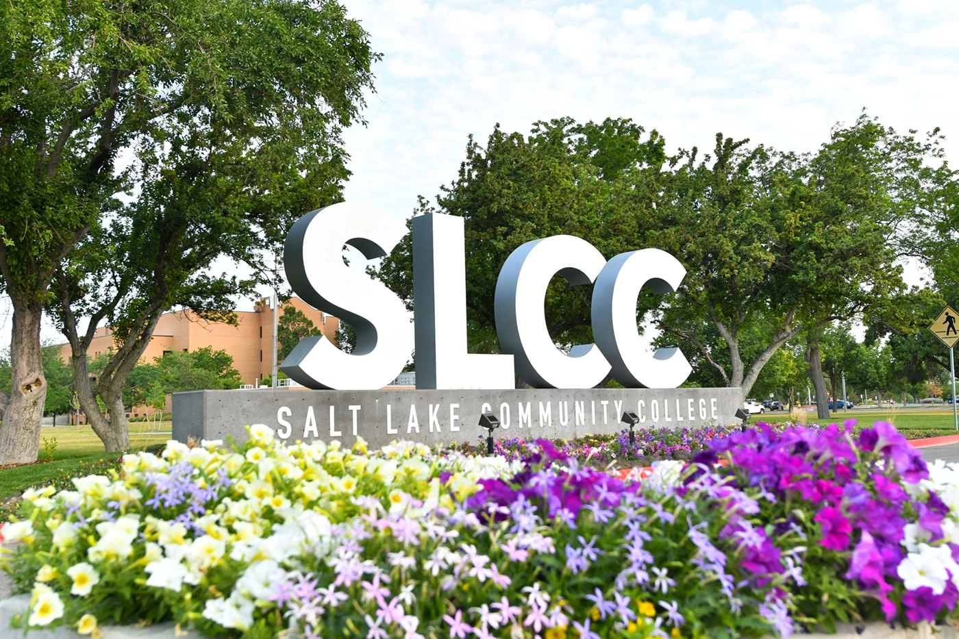 SLCC block letters with flowers in front.