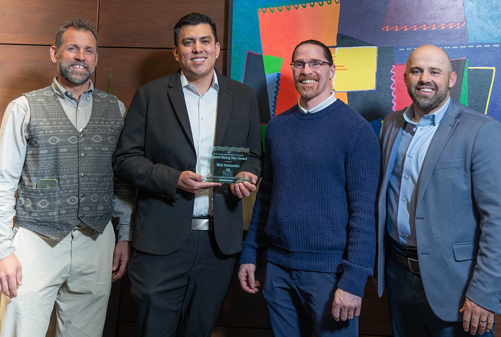 (Left to Right) Bob Whittaker, SLCC executive director of Development, Rising Star recipient Rick Hernandez, Greg Peterson, SLCC president, and Mike Bird, chair of the SLCC Alumni Leadership Council.