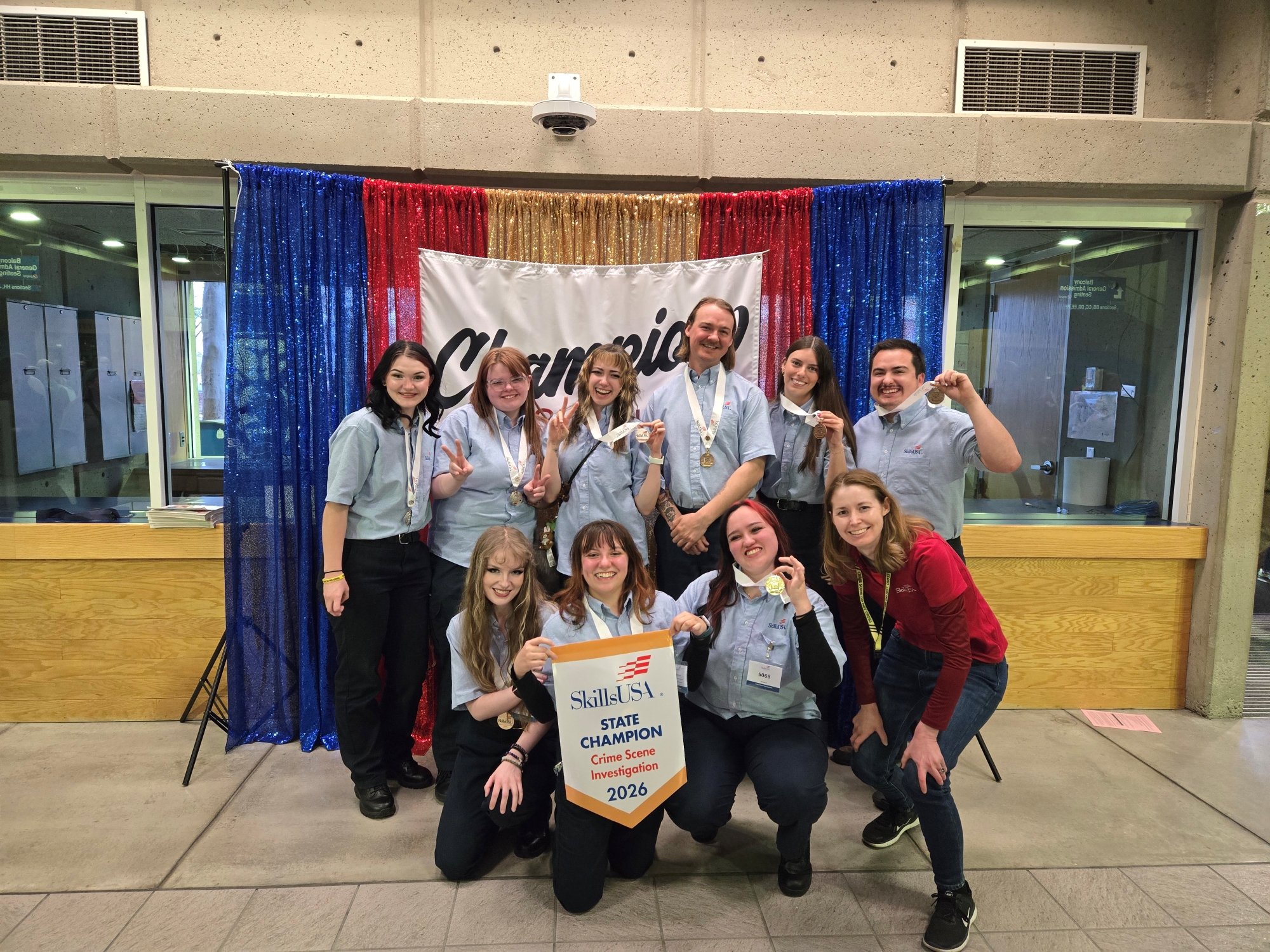 SLCC Crime Scene Investigation teams pose with medals and a SkillsUSA State Champion banner at the 2026 SkillsUSA Utah competition.