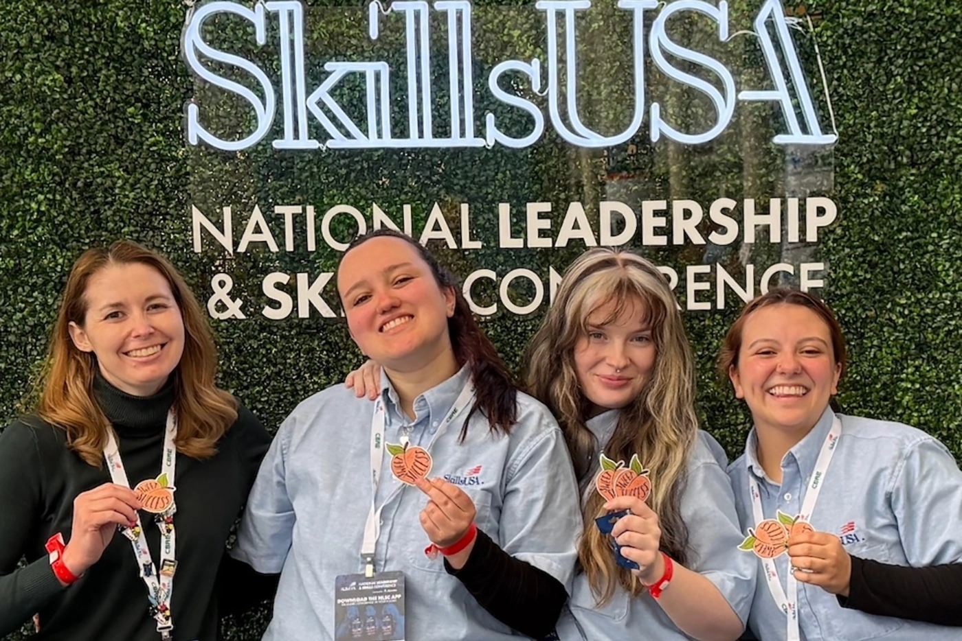 SLCC Associate Professor Stephanie Hoffman, and Forensic Science Students, Haylee Ramirez, Kylee Hermeling and Kennedi Leon, pose for a picture at the National Skills USA competition in Atlanta, Georgia.