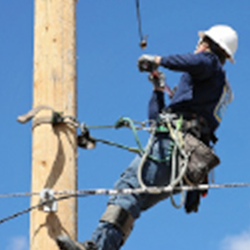 a man in a line pole working